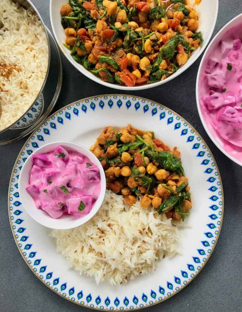 chana saag served with rice and beet raita