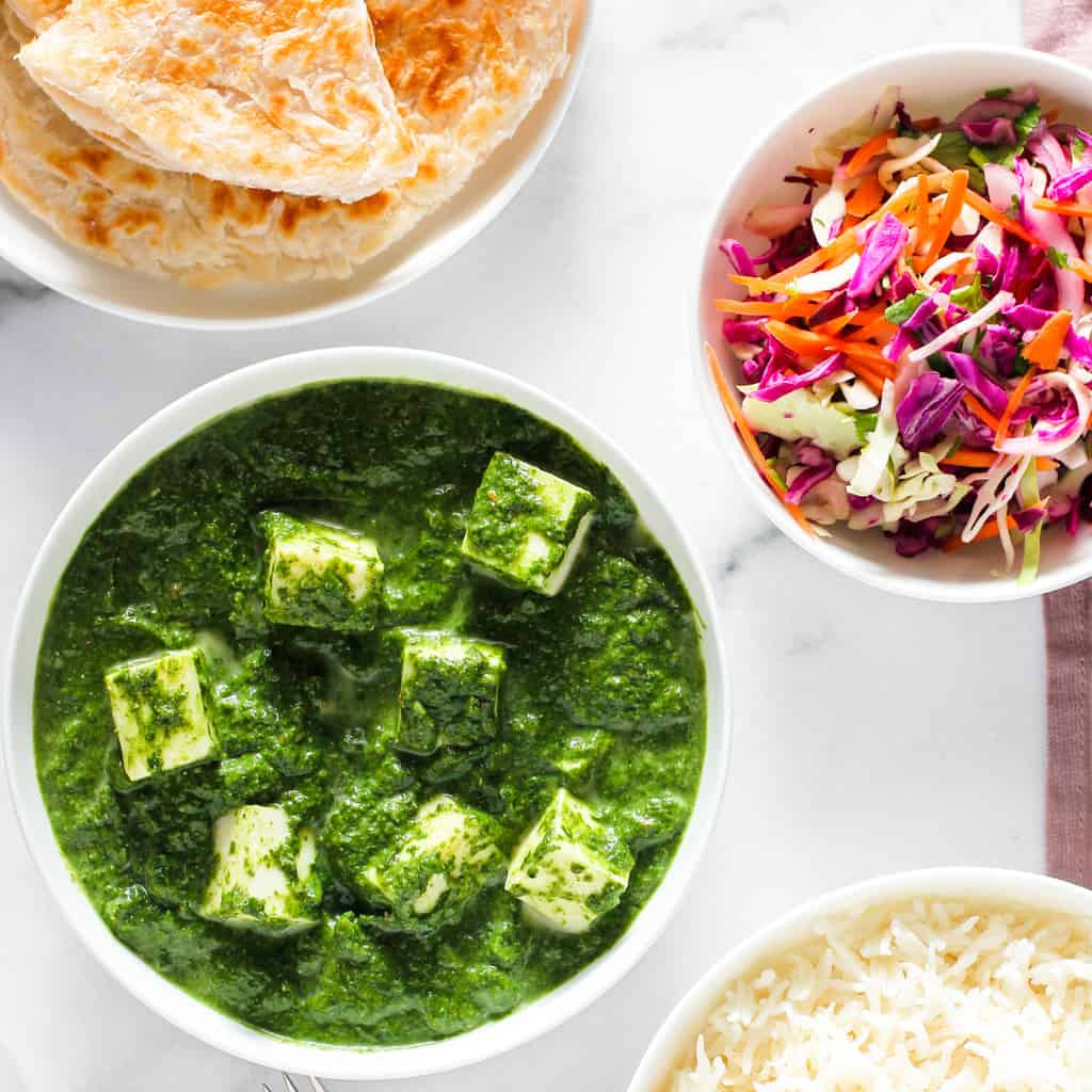 Palak Paneer served with paratha, rice & salad