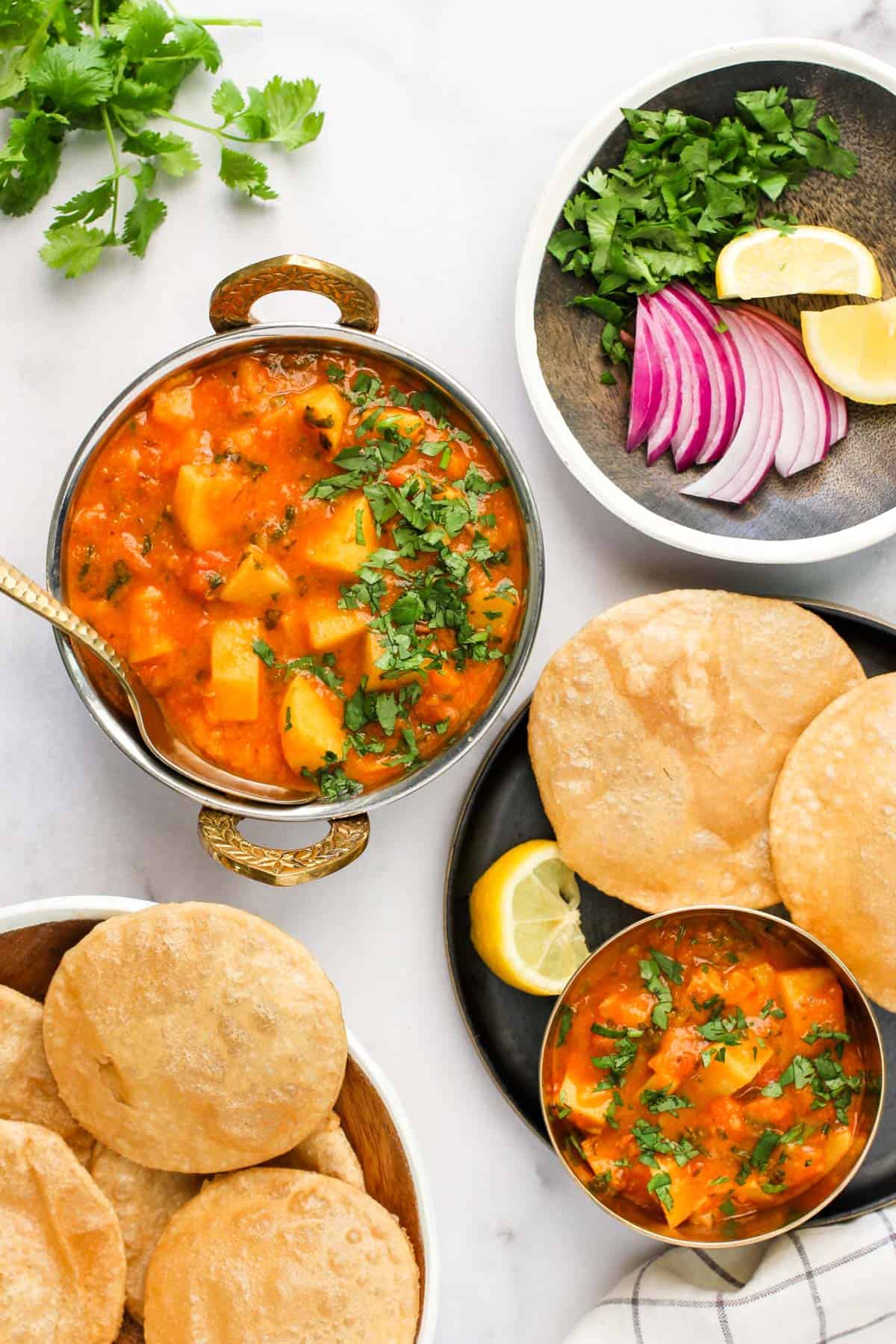 aloo rasedar served with puri