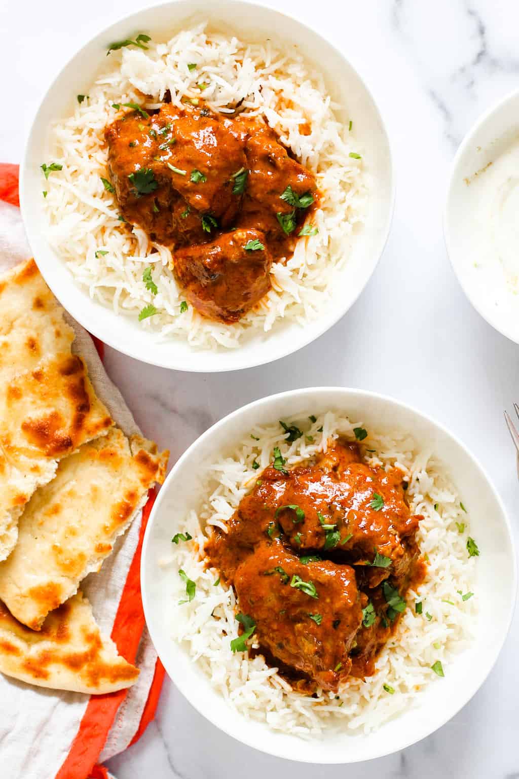 Butter Chicken served with rice and naan