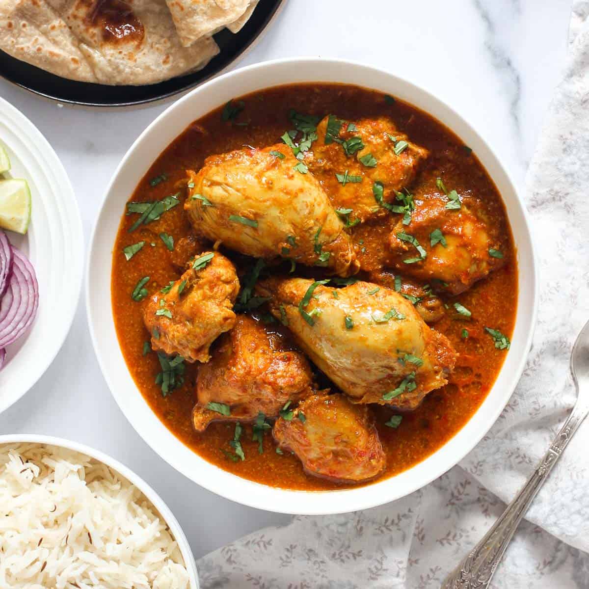 chicken curry served on a white bowl