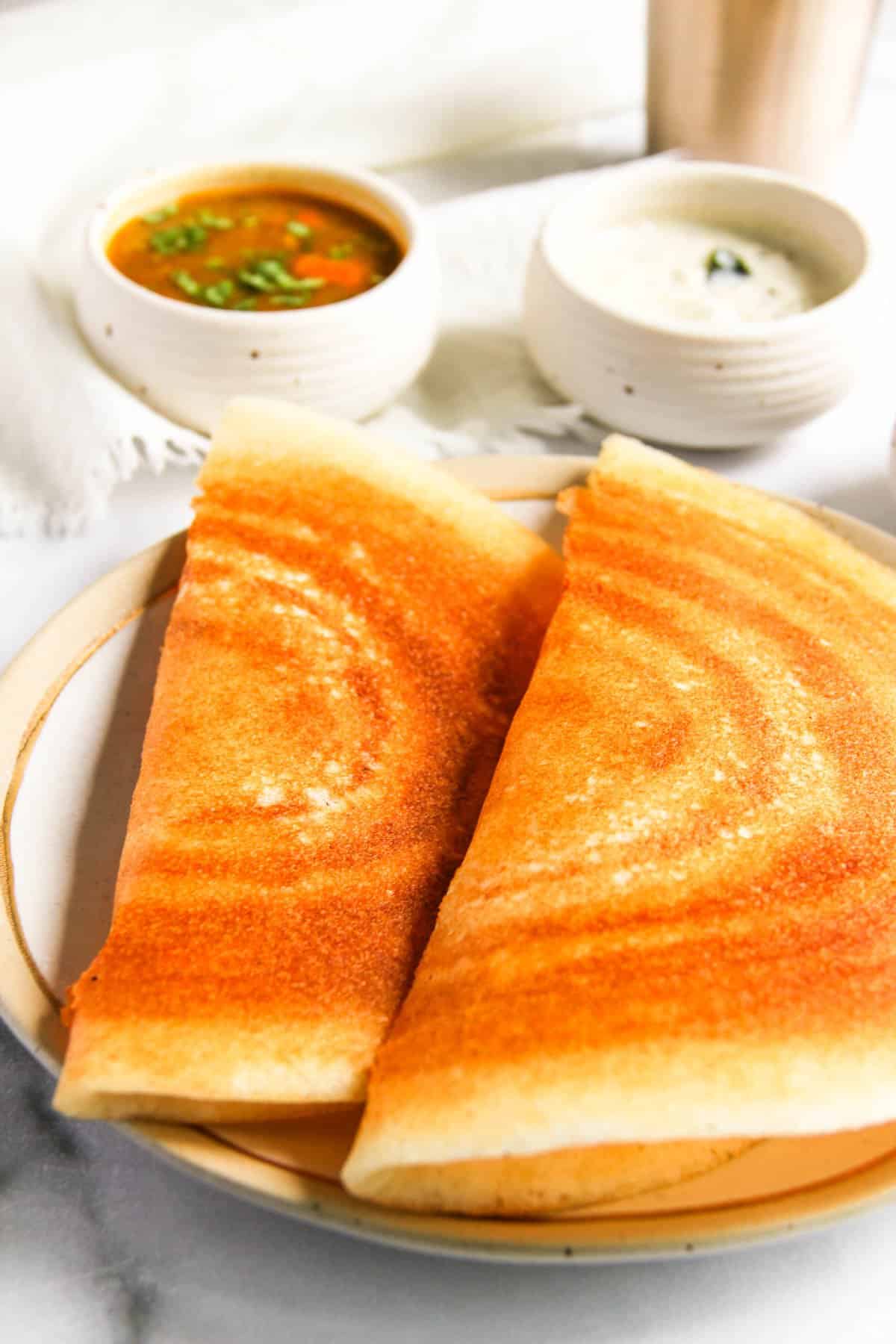 crispr dosa served with coconut chutney and sambar 