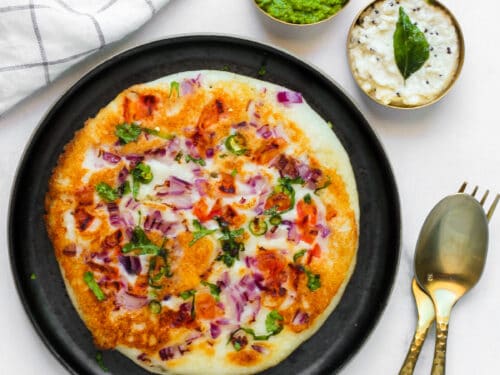 Uttapam served with cilantro chutney and coconut chutney