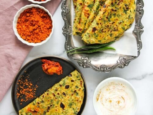 Kale parathas served with yogurt and chutney