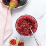 fig jam in a jar with fresh figs on the side